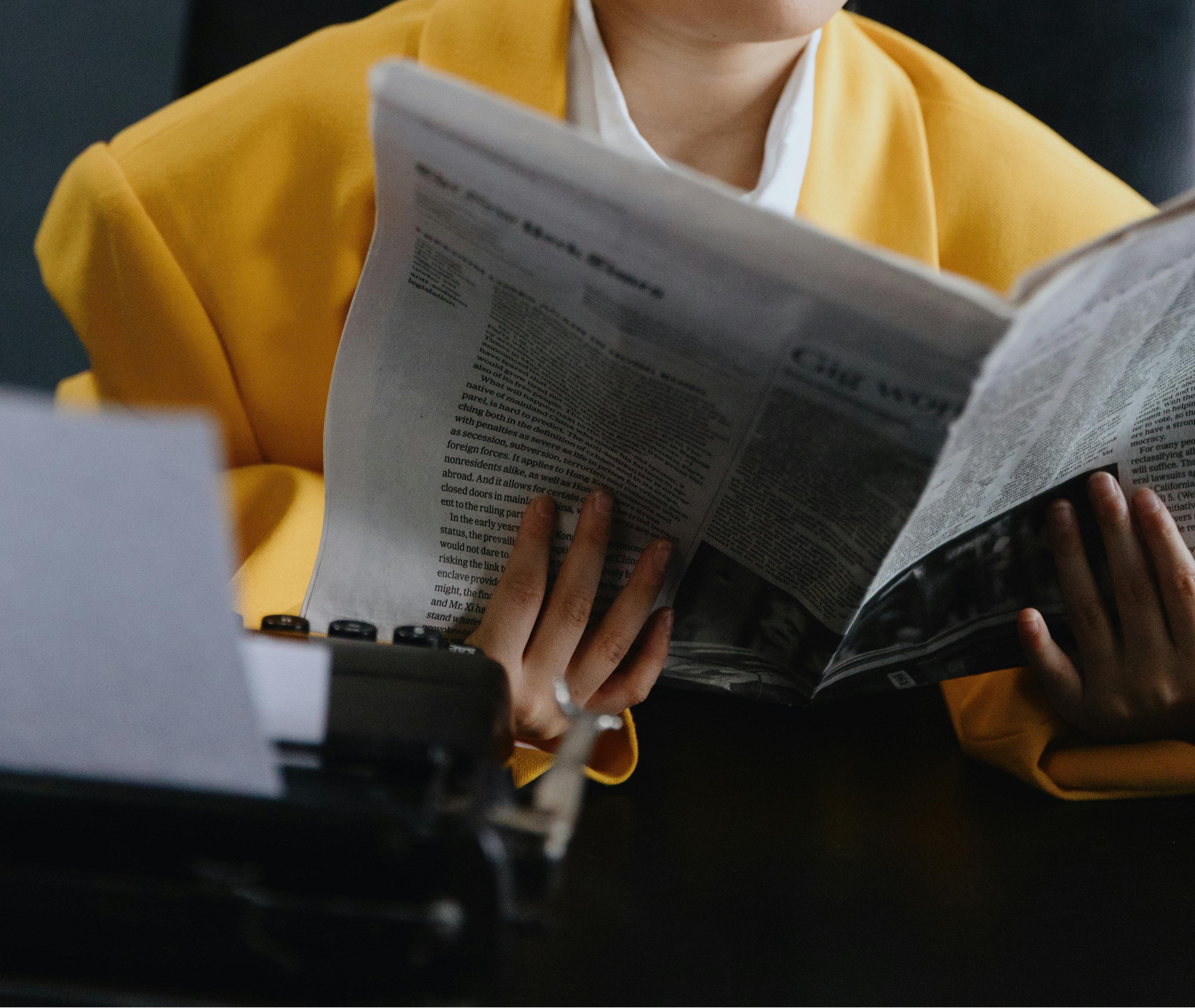 Person reading newspaper